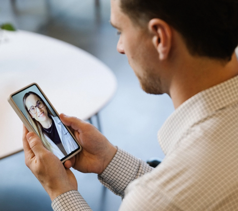 man with smartphone in telemedcine conversation