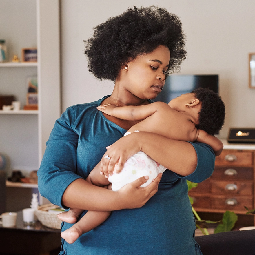 a mother holding her baby