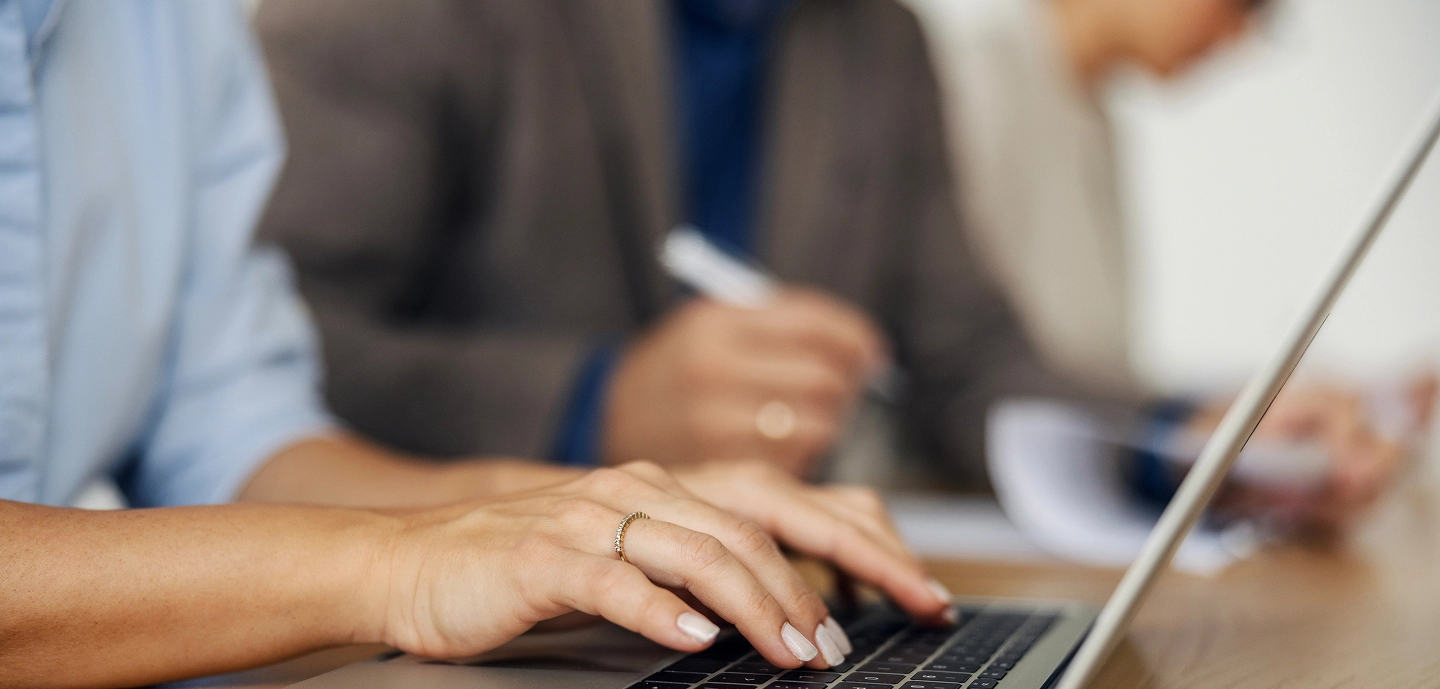 Hands typing on keyboard
