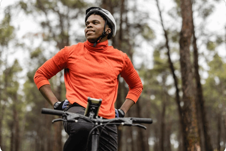A man out for a bike ride in a forest