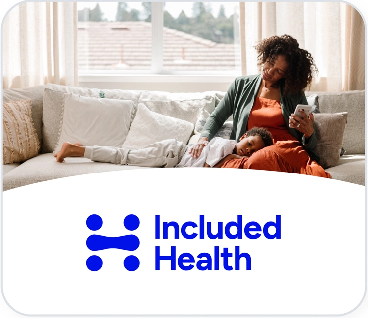 woman with child and smartphone on sofa