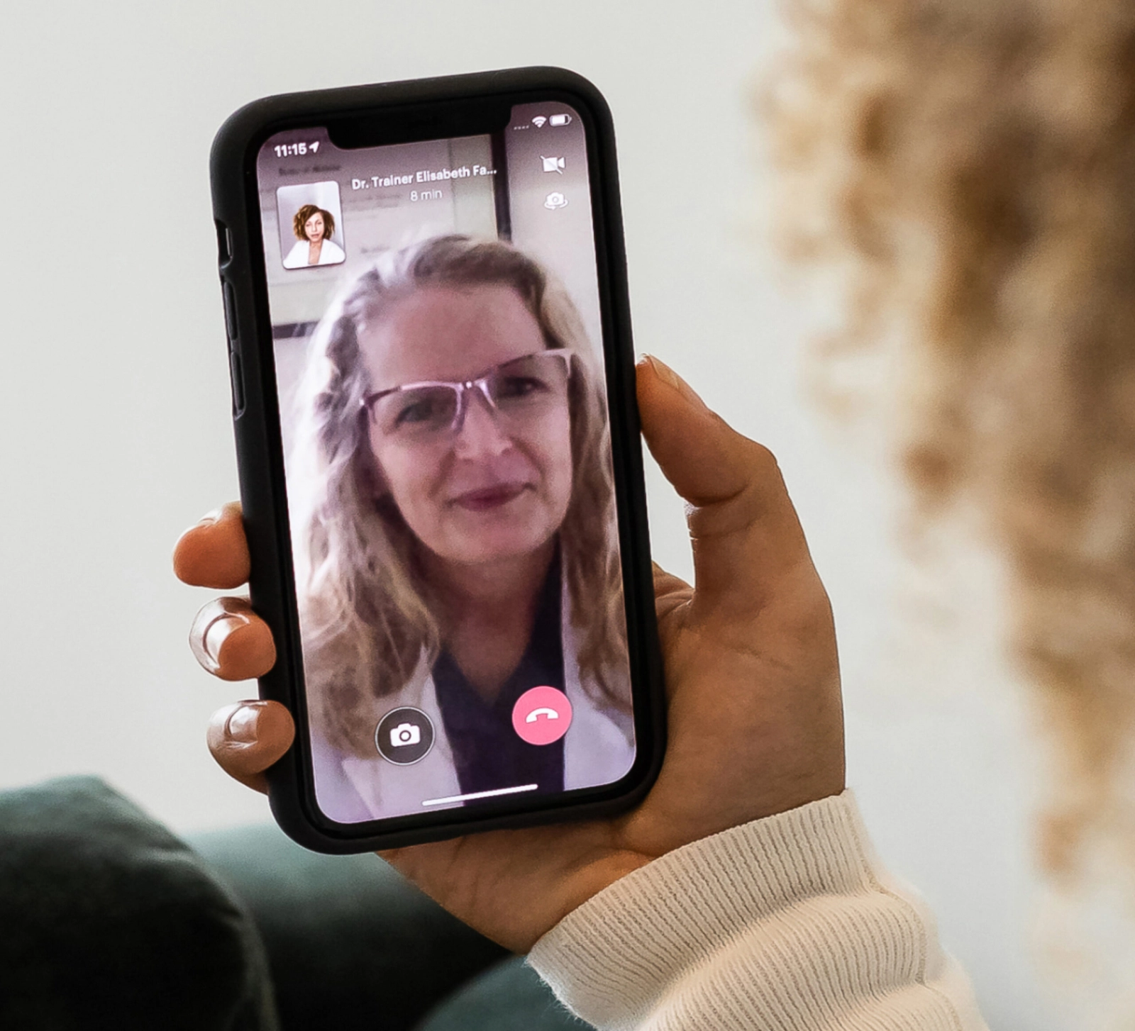 A woman having a video call with her doctor.