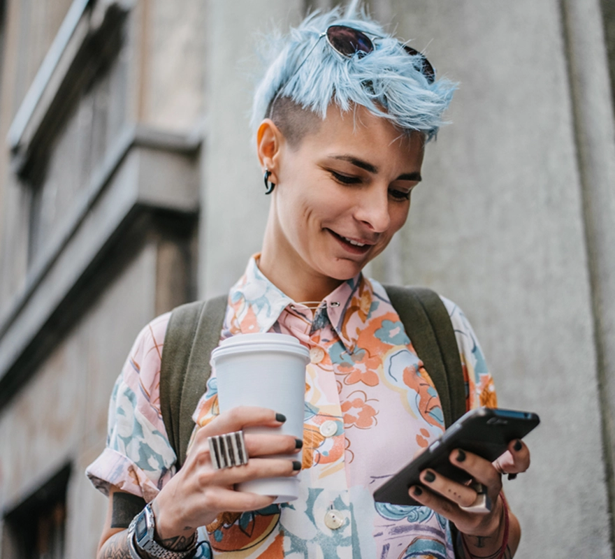 An Included Health Member using her phone to interact with Included Health.