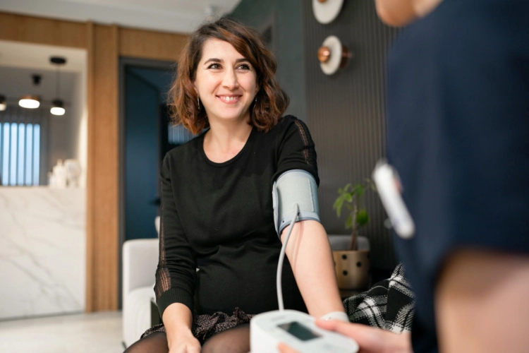 A woman getting her blood pressure taken.