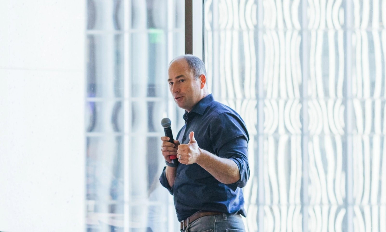 A header image showing Owen Tripp speaking at an event.